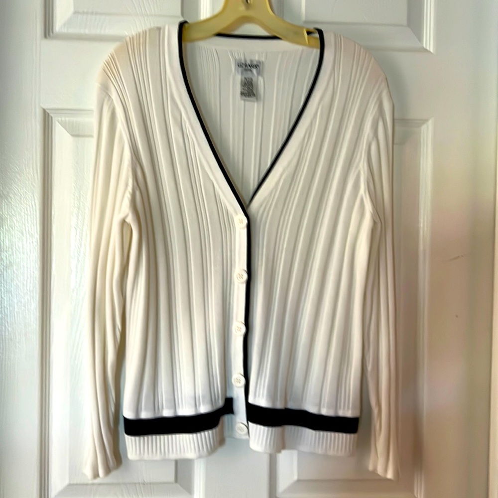 Two pieces sweater and sleeveless top goes underneath. White with navy trim. EUC